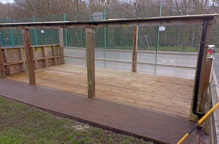 Covered timber deck built over a former school sandpit