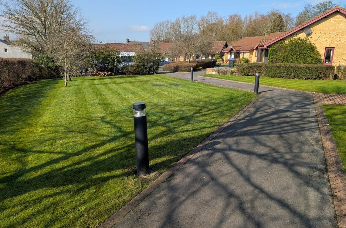 Large estate lawn mown in clean stripes